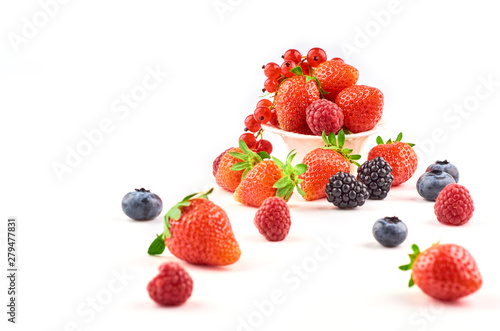 Composition of strawberries, blackberries, blueberries, raspberries and red currants on a white background.