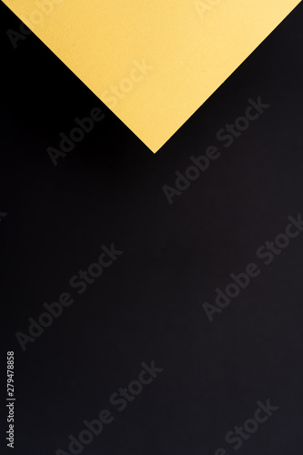 Blank black and gold geometric triangular vertical background. Layout for business, posters and banners.