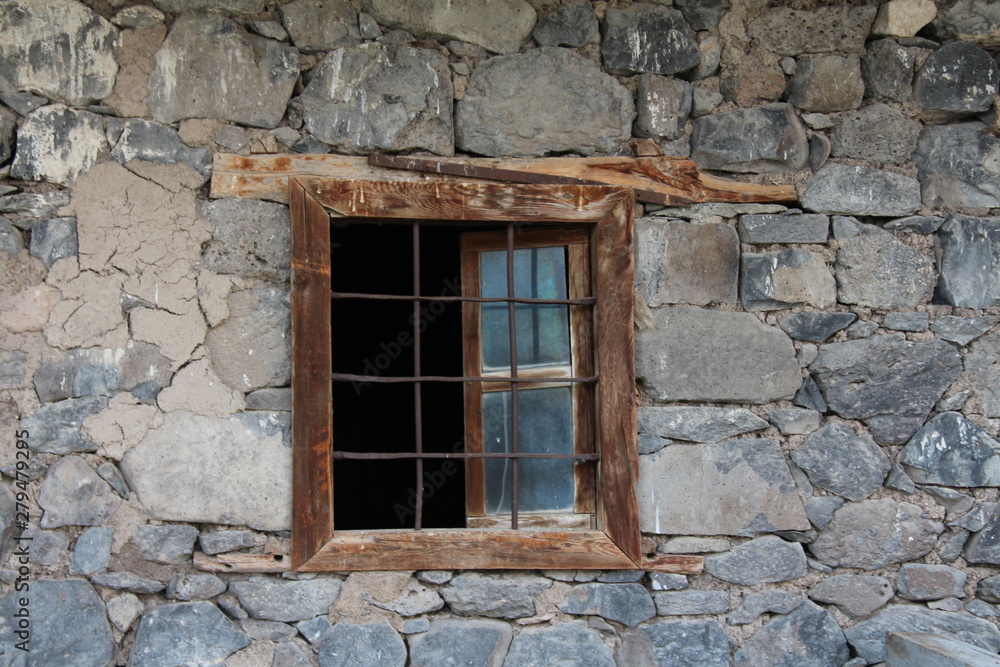 old window in old stone wall