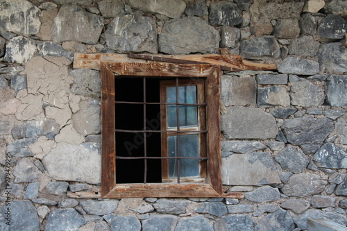 old window in old stone wall