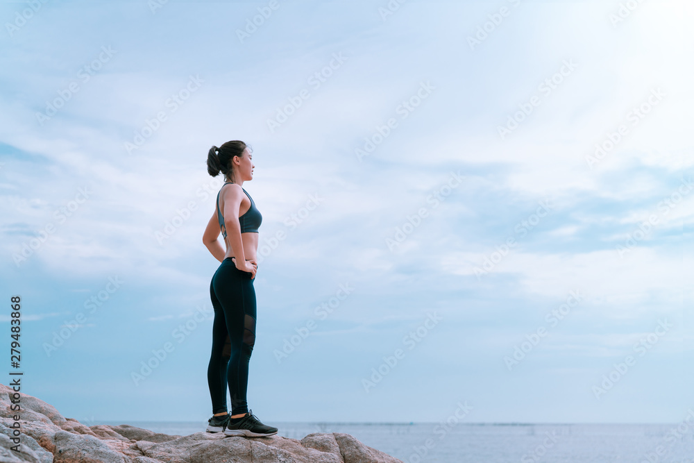 Relaxed and goal challenge athlete asian jogging woman fitness workout outdoor at the beach on sunset for healthy lifestyle after cardio training, Sporty marathon, Success body slim concept copy space Relaxed and goal challenge athlete asian jogging woman fitness workout outdoor at the beach on sunset for healthy lifestyle after cardio training, Sporty marathon, Success body slim concept copy space