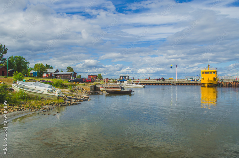 Sea side touristic port area Holmon island in a sunny northern sweden