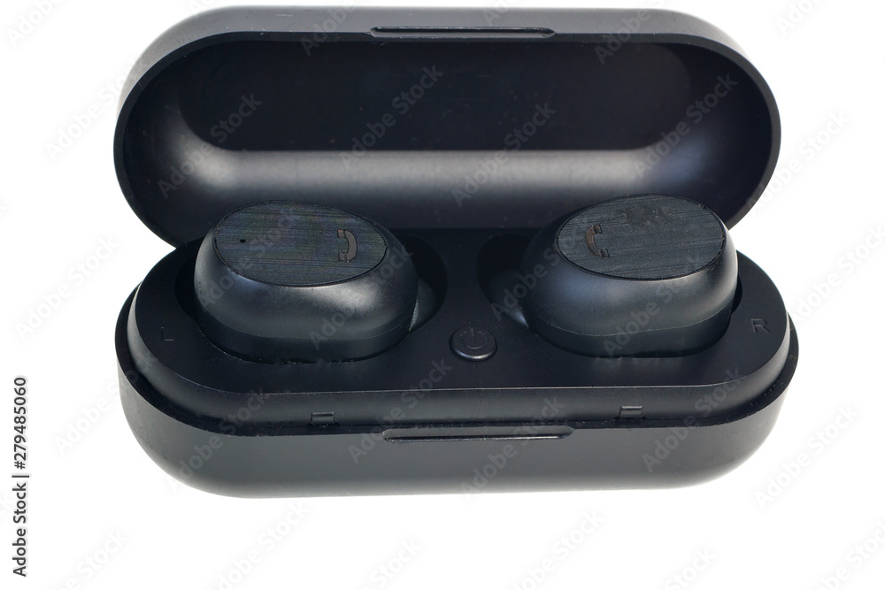 Wireless earphones.wireless headphones in the case of charging isolated on white background Wireless earphones.wireless headphones in the case of charging isolated on white background