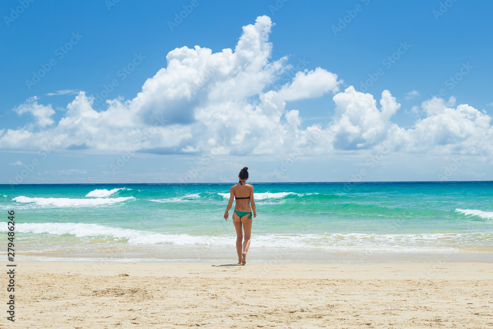 Pretty young woman, enjoying on the beach in Fuerteventura, Canary Islands, Spain. Pretty young woman, enjoying on the beach in Fuerteventura, Canary Islands, Spain.