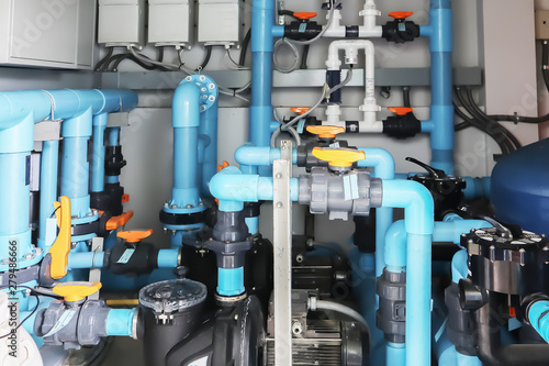 Image background of inside mechanical room of pipeline system for swimming pool.