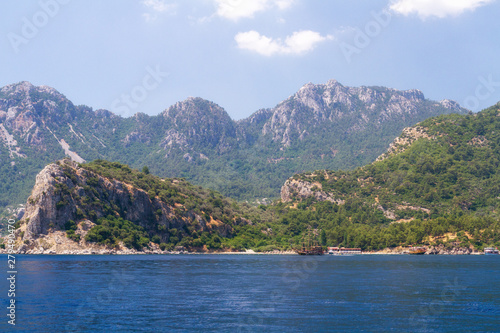 Scenic view of the Aegean Islands. The unique shades of the sea and the rocks covered with pine trees. © al1974ex