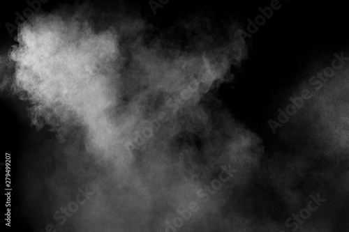 Abstract white powder explosion on a black background.Freeze motion of white powder splash.