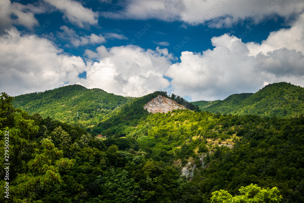 Mountain and forest, cloudy day with dark clouds. Near the Ibar river and Maglic castle in Serbia