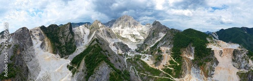 Aerial view of mountain of stone and marble quarries in the regional natural park of the Apuan Alps located in the Apennines in Tuscany, Massa Carrara Italy. Open pit mine