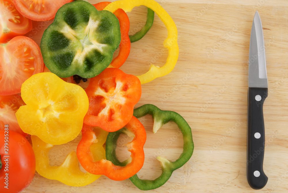Tomatoes, pepper and knife on wooden background Tomatoes, pepper and knife on wooden background