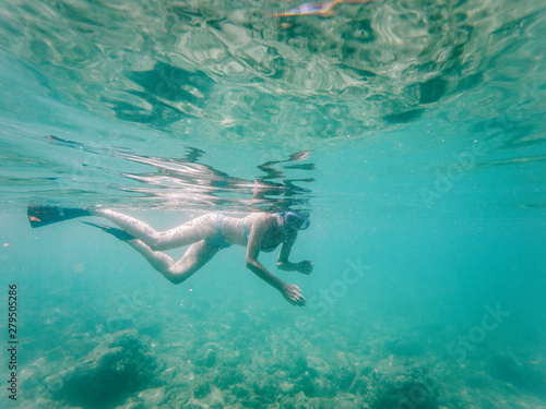 woman snorkeling in clear tropical waters - active holiday © Melinda Nagy