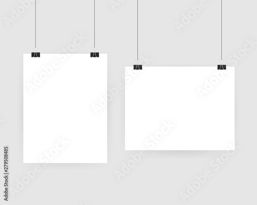 Set of multicolored binder clips on a piece of paper on a transparent background. Clerical clothespin on a transparent background