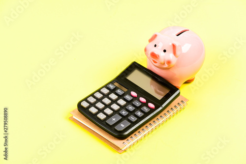 money saving. Accounting and payroll. bookkeeping. financial report. capital management. planning counting budget. Commerece business. moneybox with calculator. Piggy bank. Beyond poverty photo