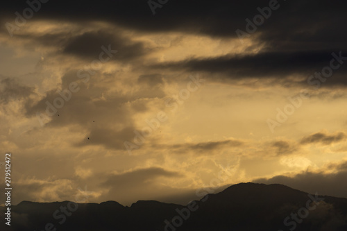 sunset in the mountains with clouds