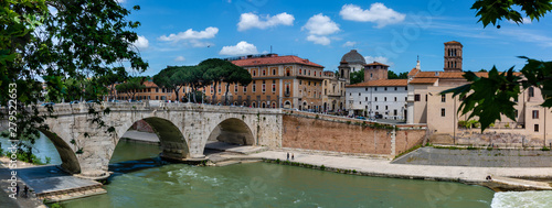 Panoramic view of bridge above Tiber river and Trastevere area in Rome, Italy.