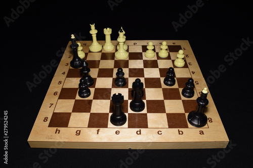 Chess board with black pawns as a hobby concept