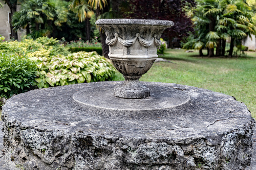 vintage stone vase raised in the garden