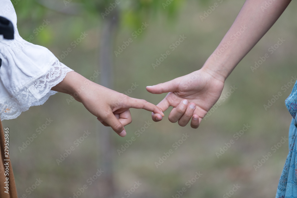 two hands touching, very young they touch their finger, love concept two hands touching, very young they touch their finger, love concept