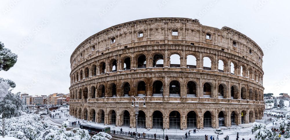 The Roman Colosseum after a winder snowfall in Rome, Italy.