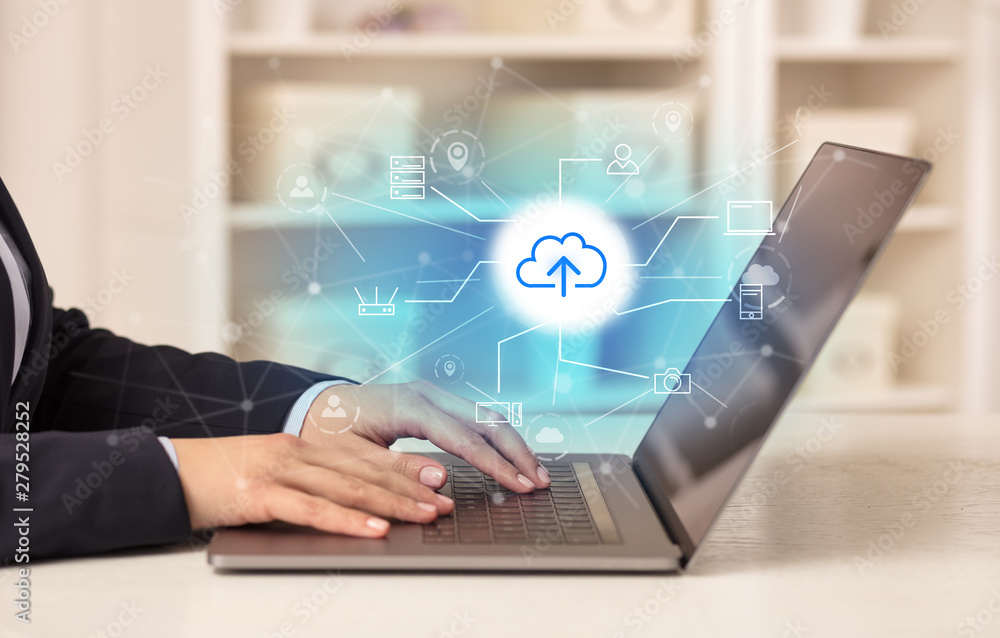 Business woman in homey environment using laptop with online storage and cloud technology concept Business woman in homey environment using laptop with online storage and cloud technology concept