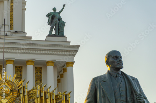 Soviet communist leader Vladimir Lenin statue in front of old building at VDNH in Moscow