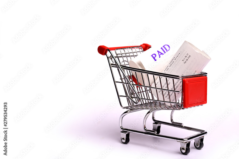 Shopping Receipts in shopping trolley isolated on white background