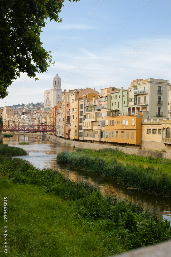 Girona's skyline with famous landmark cathedral and river houses