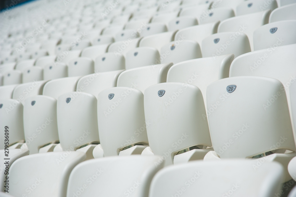 Naklejka premium Empty white seats in stadium