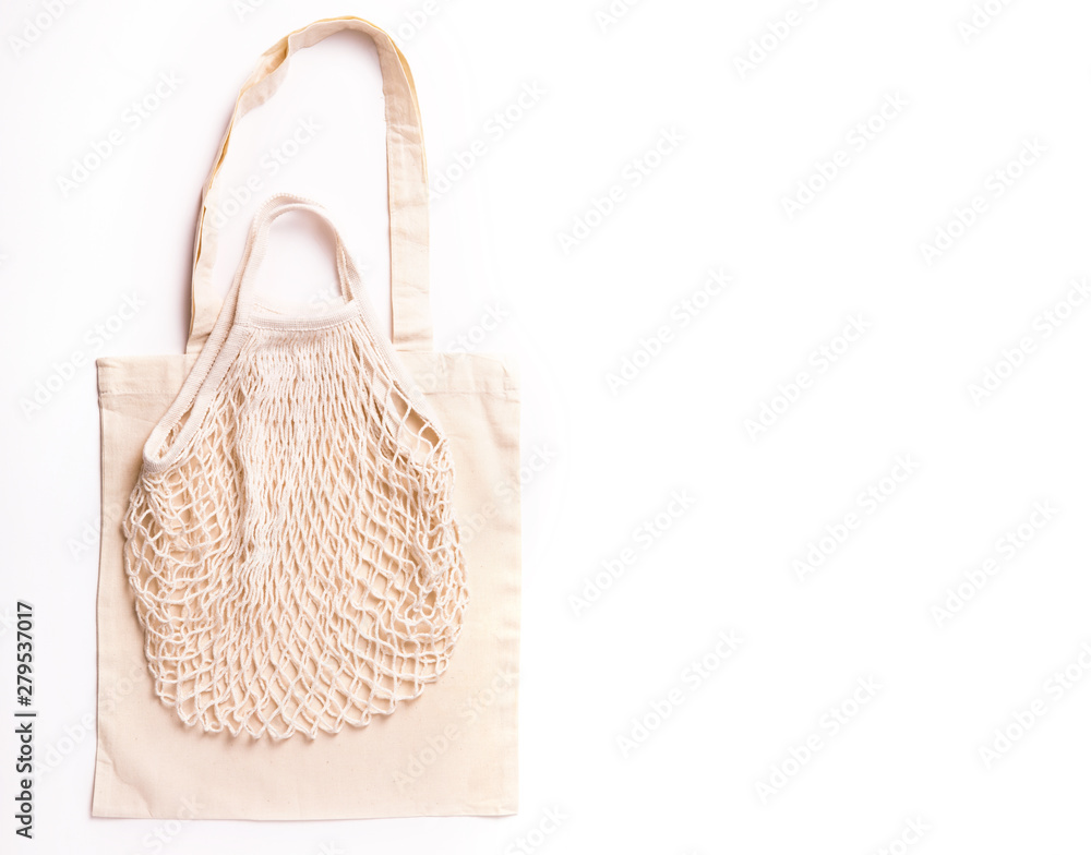 Canvas cotton shopping eco friendly bag over white background. Zero waste, plastic free concept. Top view, flat lay Canvas cotton shopping eco friendly bag over white background. Zero waste, plastic free concept. Top view, flat lay