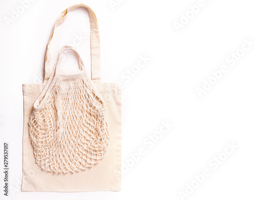 Canvas cotton shopping eco friendly bag over white background. Zero waste, plastic free concept. Top view, flat lay
