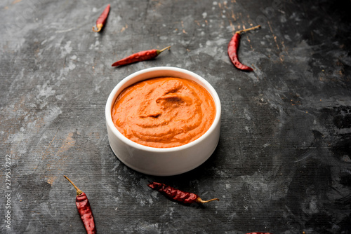 Peri Peri Sauce in a bowl, originally from portugal, it's a hot sauce made using piri piri or African bird's eye chillies.  selective focus photo