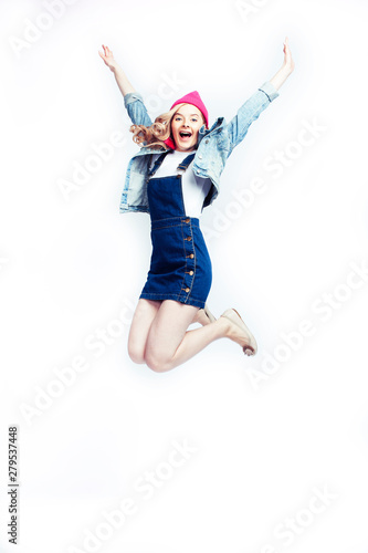 pretty blonde teenage girl jumping happy smiling on white background, lifestyle people concept