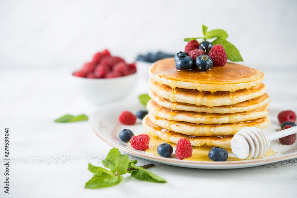 American pancakes with fresh berries and honey American pancakes with fresh berries and honey