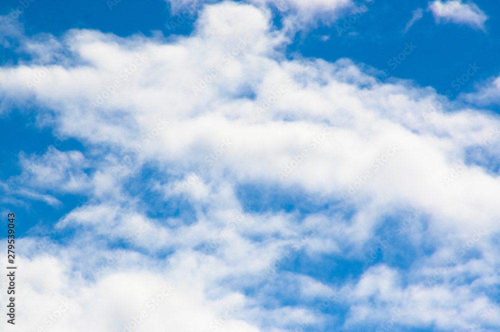 bright blue sky with white fluffy clouds bright blue sky with white fluffy clouds
