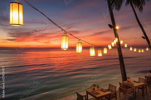 Obraz na płótnie Outdoor cafe on the beach during sunset on Koh Chang island, Thailand. w salonie