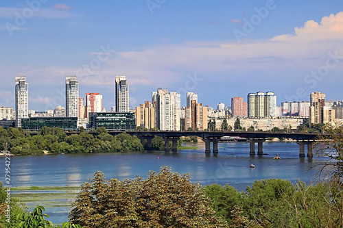 Landscape view of Dnipro river and its Left bank on the over side with new buildings in residential areas, Kyiv, Ukraine