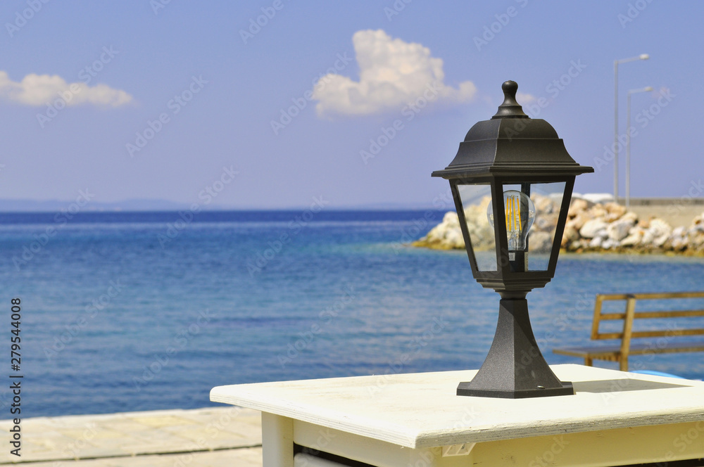 Street lamp in a cafe by the sea