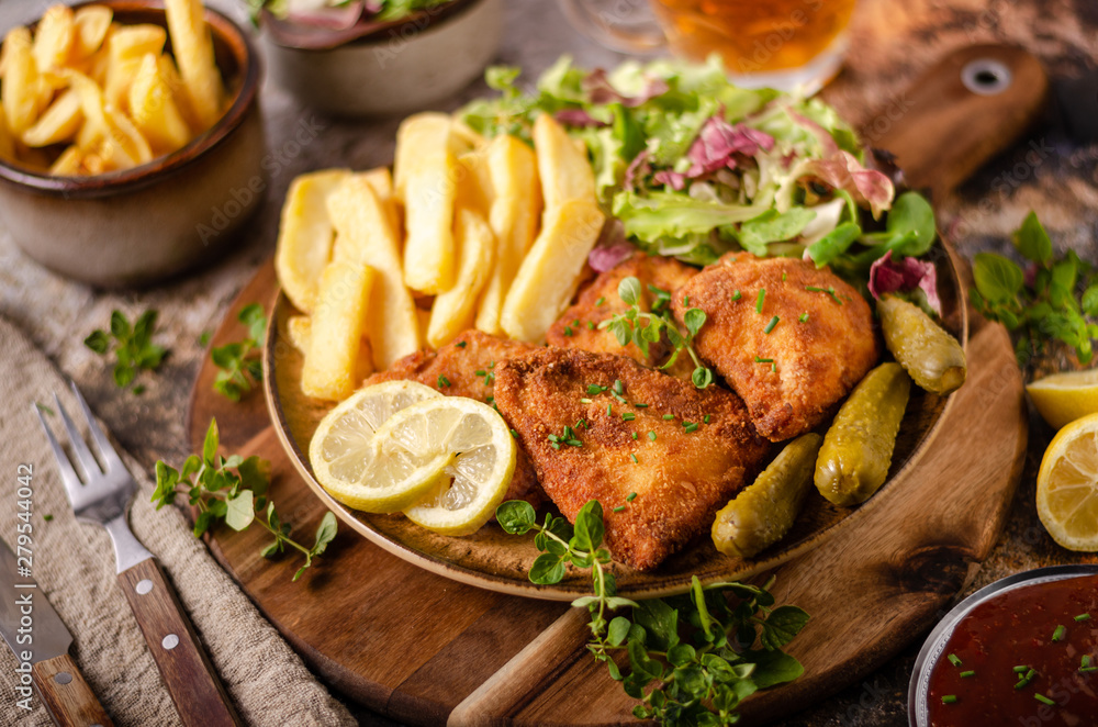 Original schnitzel with homemade french fries Original schnitzel with homemade french fries