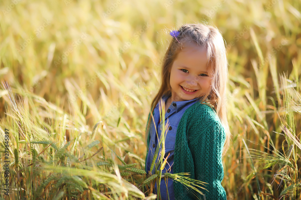A young mother walk in wheat fields A young mother walk in wheat fields