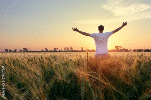photographer while working search for a story / evening landscape man on the field