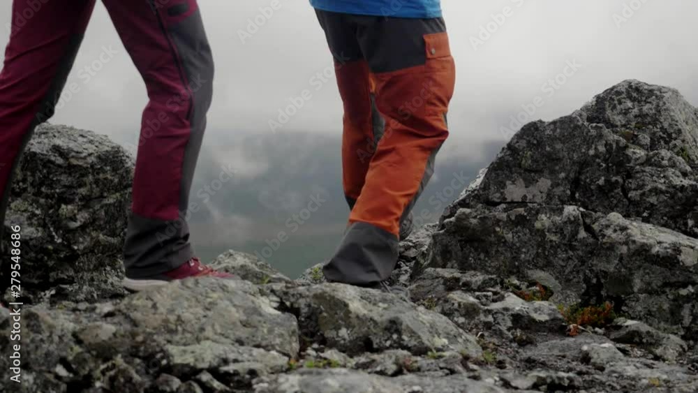Group of people travel together, teamwork concept. People hiking up a mountain, group of climbers walking. Young couple man and woman travel in the mountains, national park, trekking adventure Group of people travel together, teamwork concept. People hiking up a mountain, group of climbers walking. Young couple man and woman travel in the mountains, national park, trekking adventure