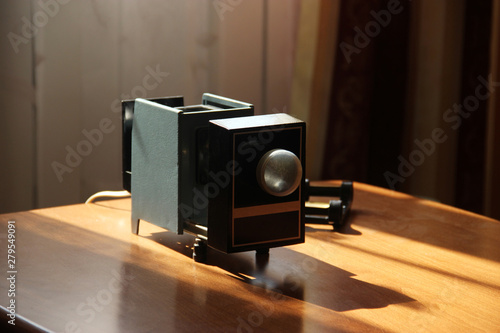 Film-viewing device slide projector lay on the table photo