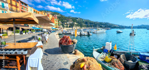 Obraz na płótnie Street scene with cafe and fishing boat in resort town Villefranche-sur-Mer. Cote d'Azur, France w salonie
