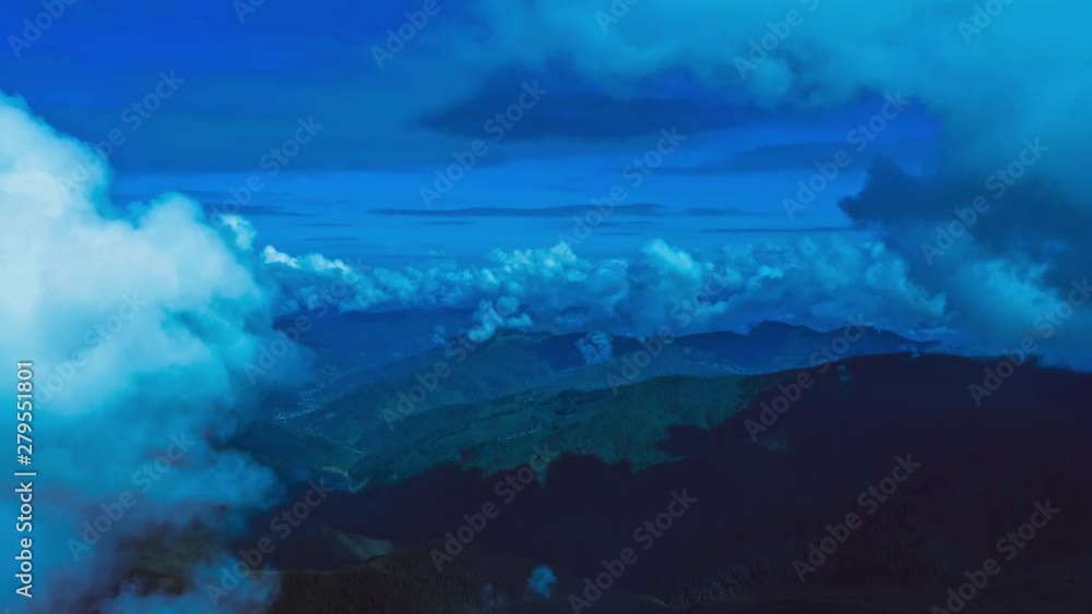 The flight in blue clouds above the mountain. Hyperlapse The flight in blue clouds above the mountain. Hyperlapse