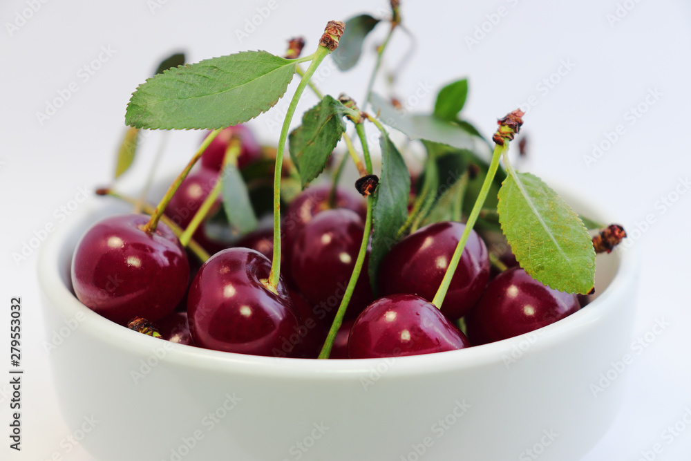 Bright colorful cherry berries on a white background Bright colorful cherry berries on a white background