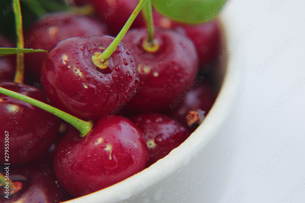 Bright colorful cherry berries on a white background Bright colorful cherry berries on a white background