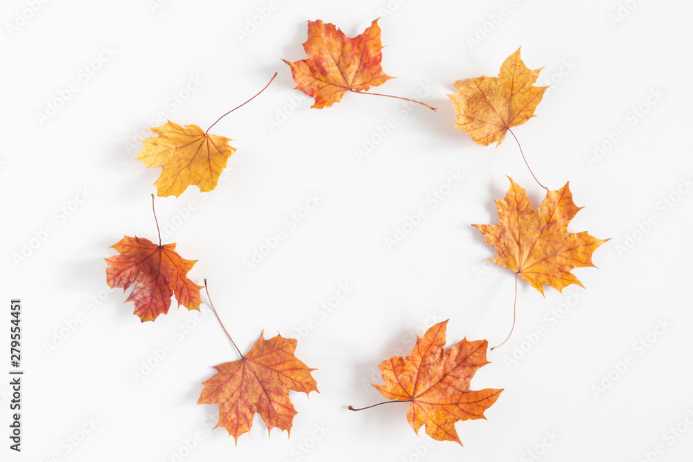 Fototapeta premium Autumn creative composition. Dried leaves on white background. Fall concept. Autumn background. Flat lay, top view, copy space