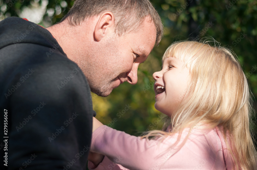 Portrait of a happy and smiling Caucasian father and daughter Portrait of a happy and smiling Caucasian father and daughter