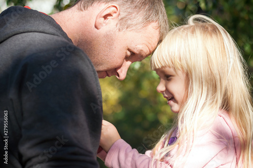 Portrait of a happy and smiling Caucasian father and daughter © Iryna