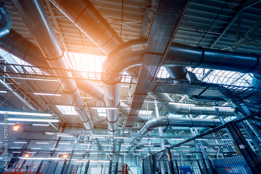 Fototapeta premium Air conditioning of buildings. Background of ventilation pipes. Laying of engineering networks.